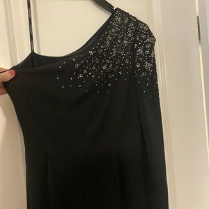 Beautiful one shoulder, long sleeve, embellished Calvin Klein jumpsuit.